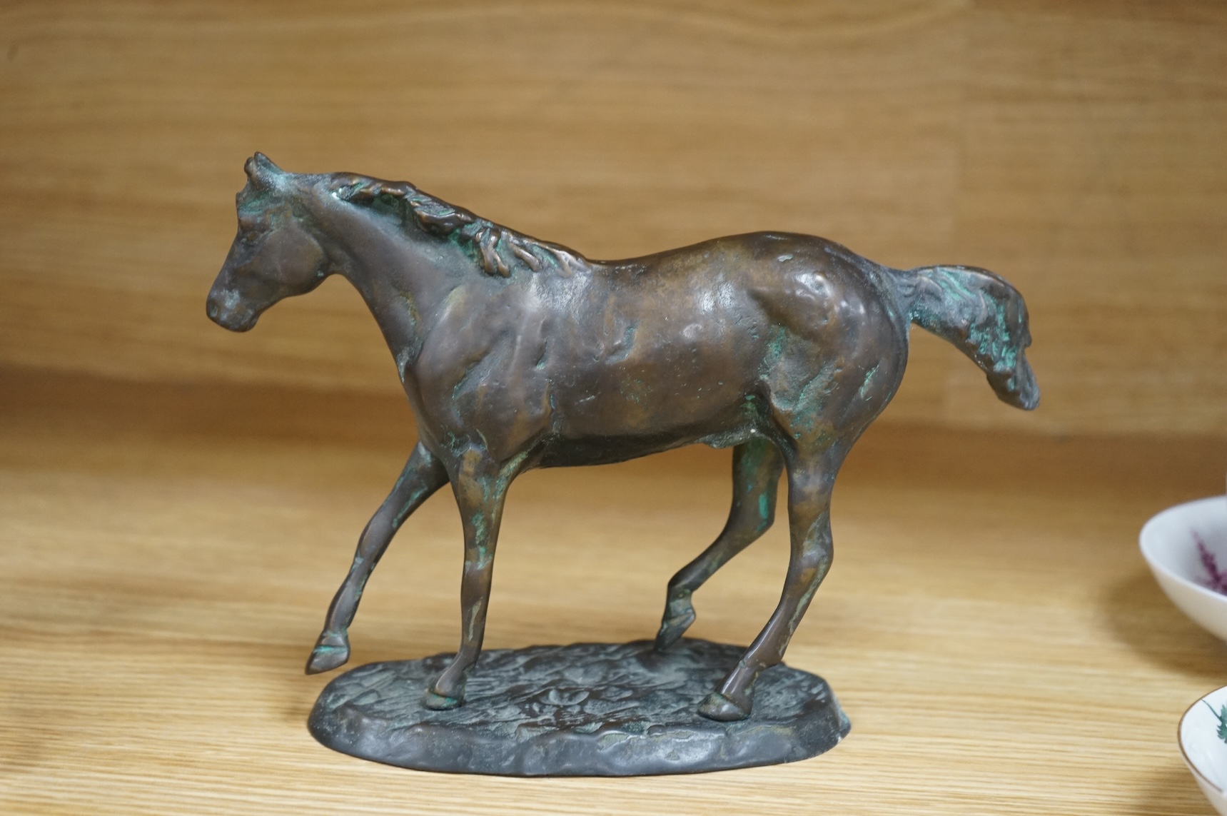 A bronze model of a horse, 23cm wide